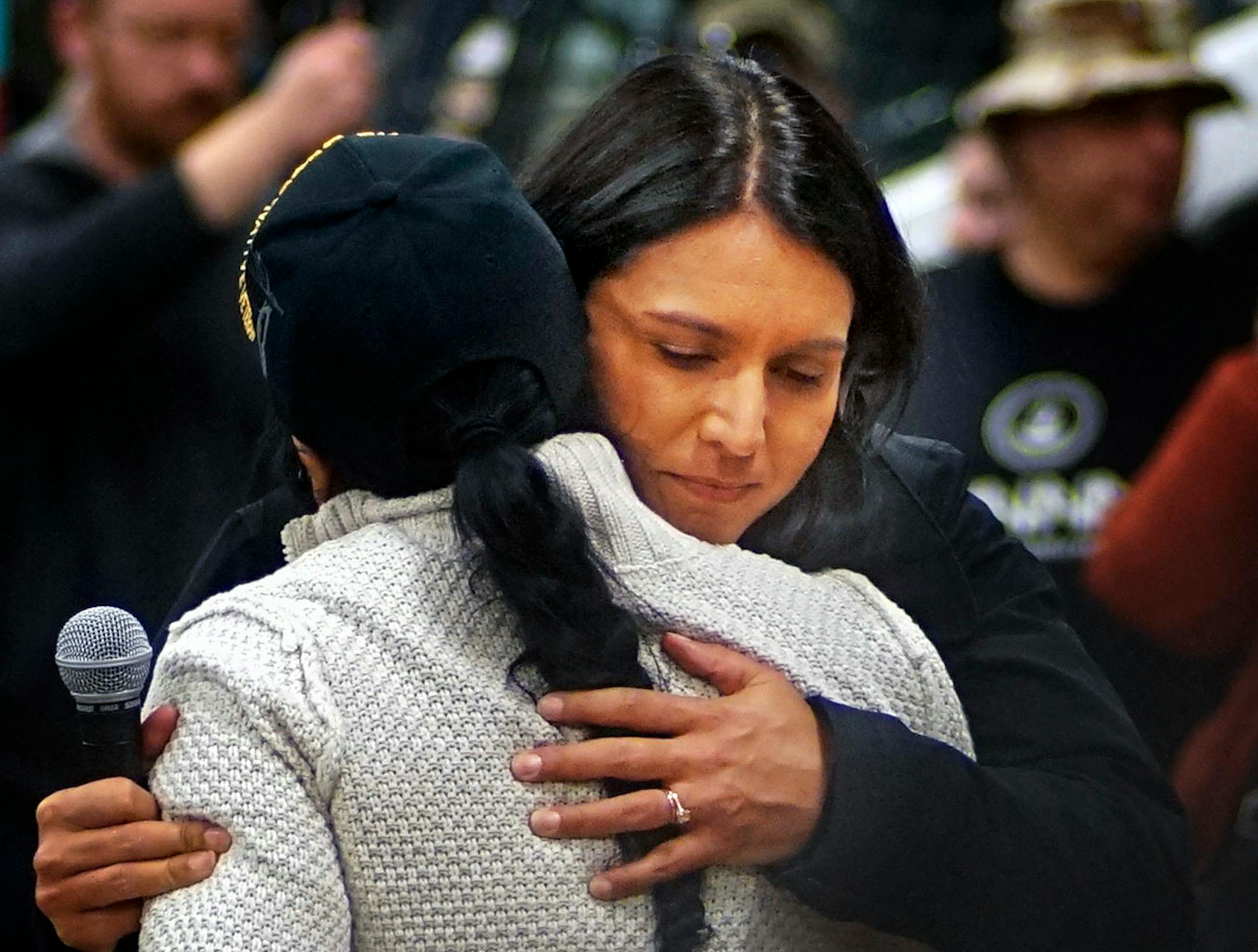 U.S. Rep. Tulsi Gabbard, D-Hawaii, hugged Brenda White Bull, coordinator of the veterans march, at Sitting Bull College in Fort Yates, N.D.