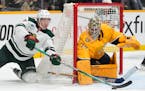 The Wild's Matt Boldy tried unsuccessfully to get a shot away against Nashville goaltender Juuse Saros, who made 32 saves Tuesday.