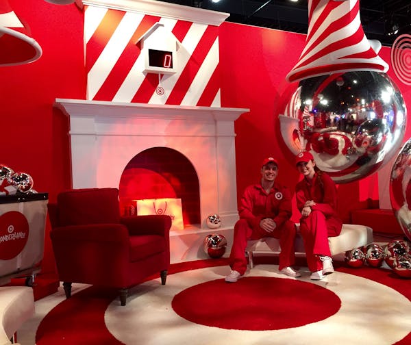 Two Target staffers posed inside Wonderland, a "retail spectacle" in New York, where the company is selling toys and experimenting with digital mercha