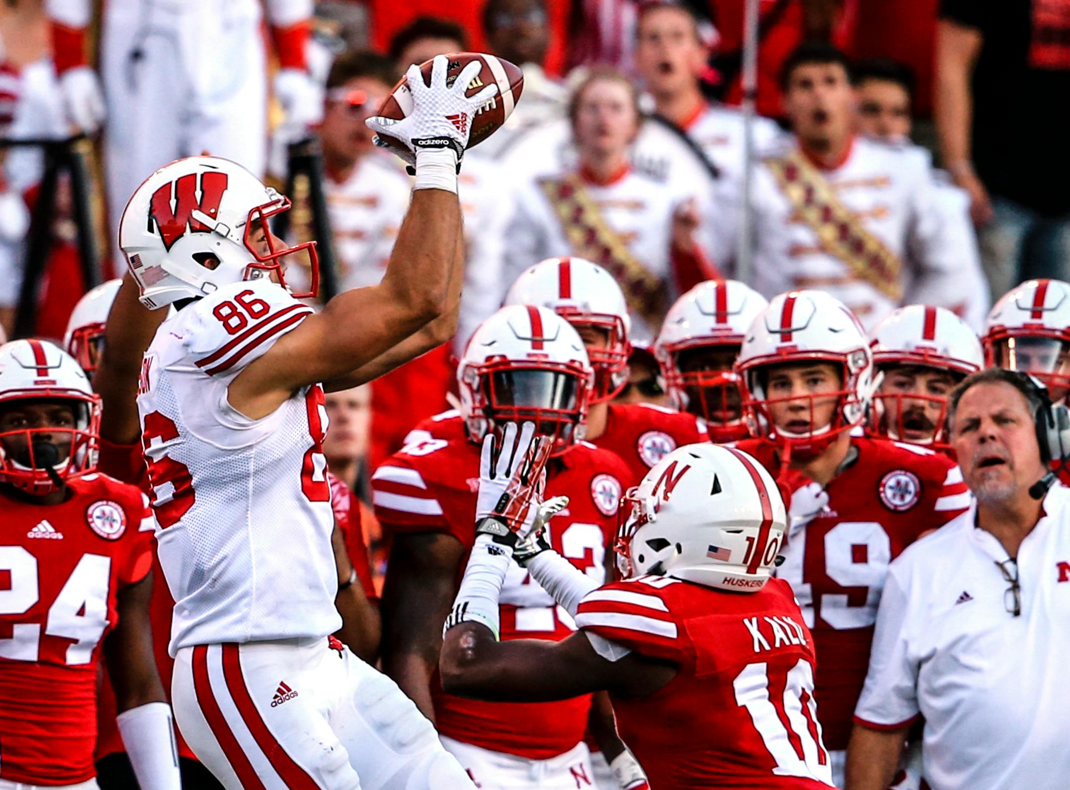 Wisconsin wide receiver Alex Erickson (86) makes a catch over Nebraska cornerback Joshua Kalu (10).