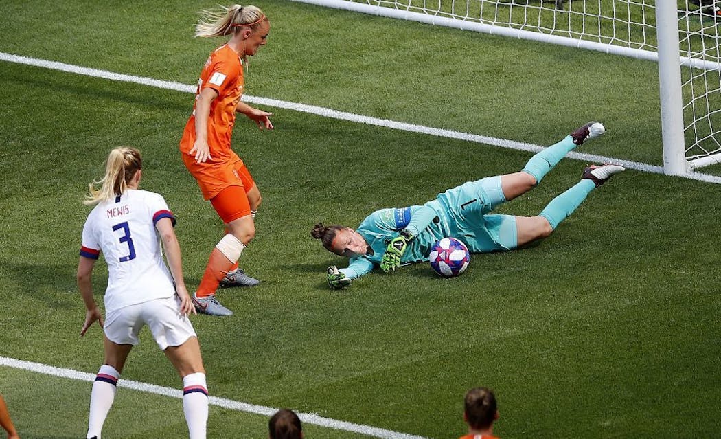 Netherlands goalkeeper Sari Van Veenendaal, right, makes a save during the first half.