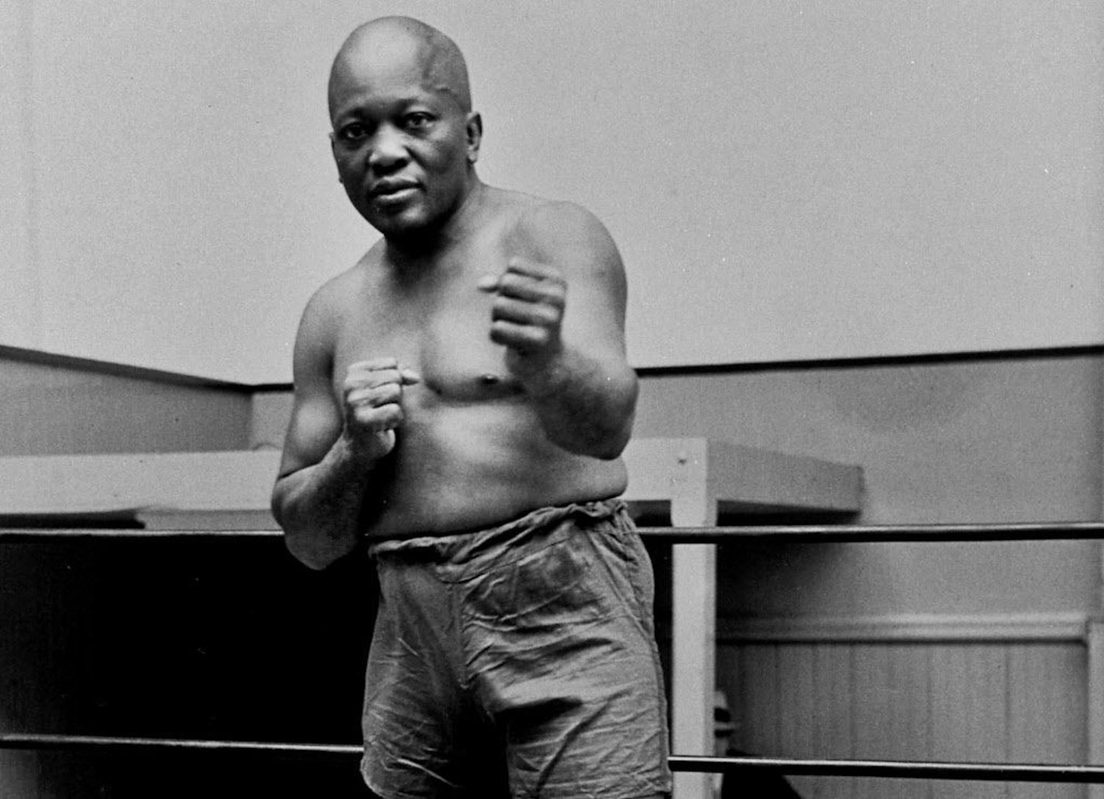 FILE - In this 1932 file photo, boxer Jack Johnson, the first black world heavyweight champion, poses in New York City. President Donald Trump on Thursday, May 24, 2018, granted a rare posthumous pardon to boxing's first black heavyweight champion.