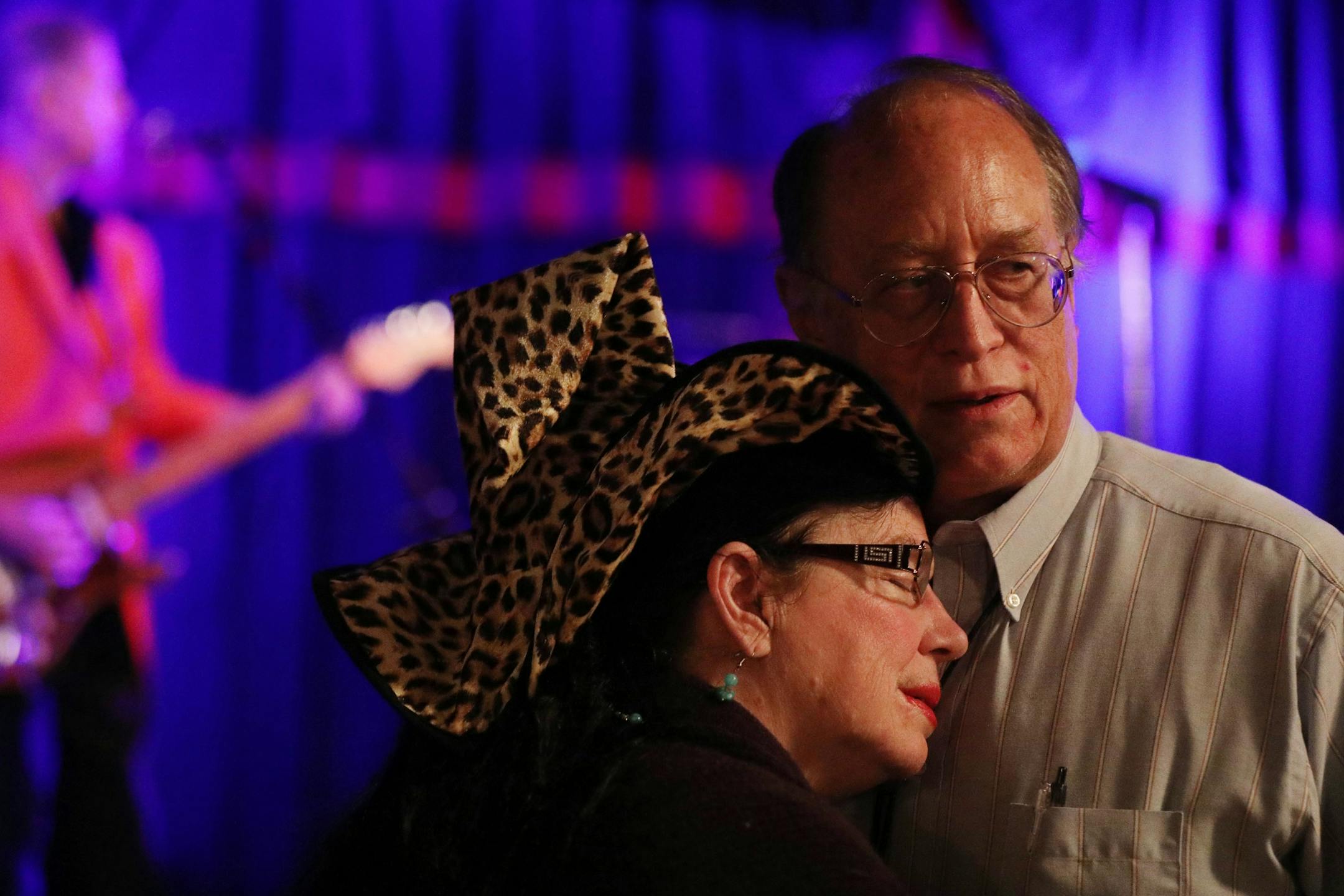 A couple who declined to provide their names slow danced together.