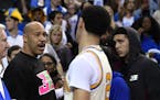 FILE - In this March 4, 2017, file photo, UCLA guard Lonzo Ball, right, shakes hands with his father LaVar following an NCAA college basketball game a