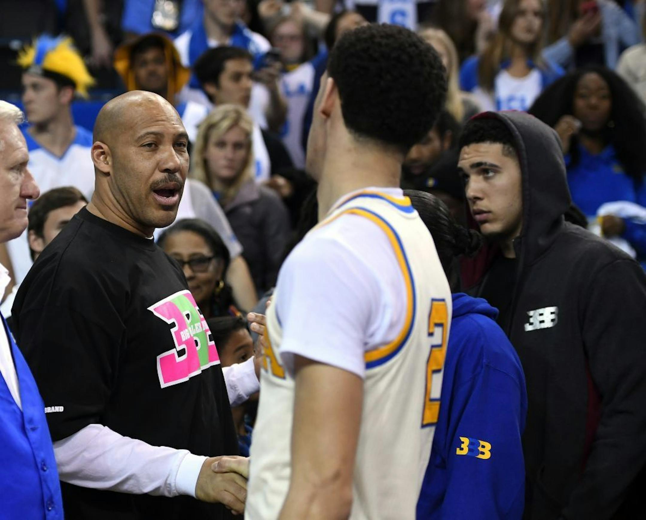 FILE - In this March 4, 2017, file photo, UCLA guard Lonzo Ball, right, shakes hands with his father LaVar following an NCAA college basketball game against Washington State in Los Angeles. UCLA won 77-68. LaVar Ball's Big Baller Brand unveiled a signature shoe for Lonzo Ball on May 4, 2017 with a price tag of $495 a pair.