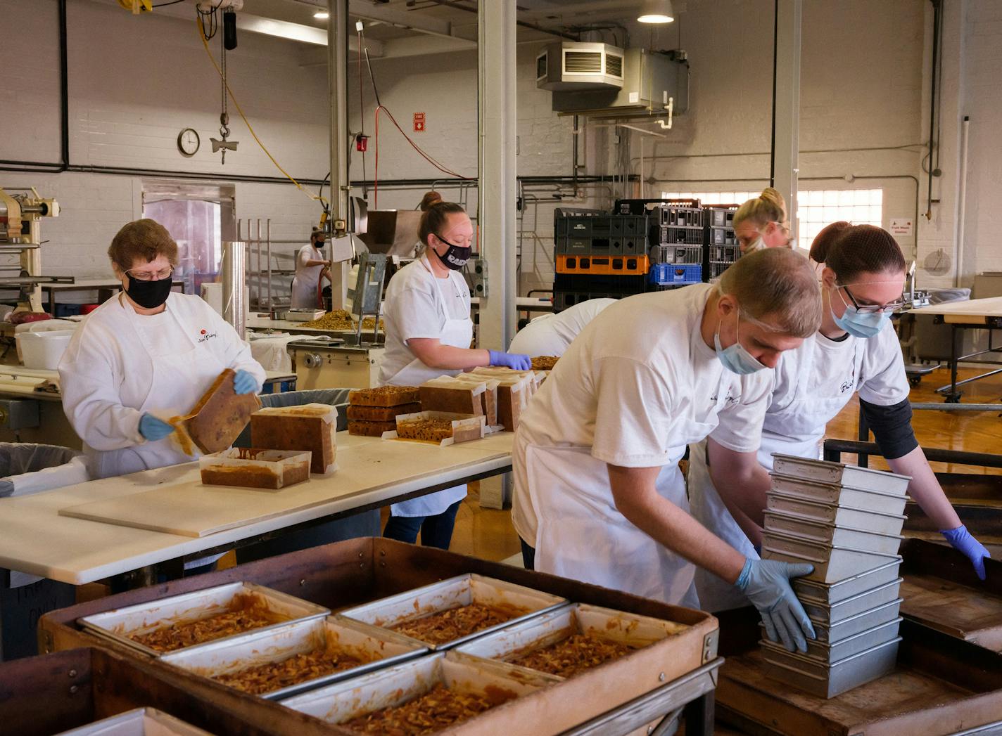 Retailers, such as Beatrice Bakery in Nebraska, strained by a surge in e-commerce and limited by shippers, are facing pressure to deliver gifts on time.