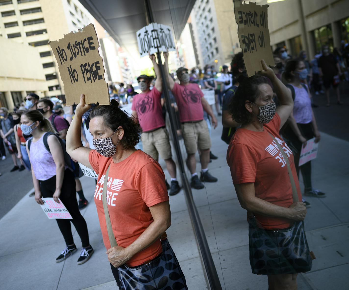 Protesters stood across the street from Minnesota Attorney General Keith Ellison's downtown St. Paul office Friday. ] aaron.lavinsky@startribune.com A demonstration, organized by Black Lives Matter and a number of local activist groups, was held outside the office of Minnesota Attorney General Keith Ellison on Friday, June 5, 2020 in St. Paul, Minn.