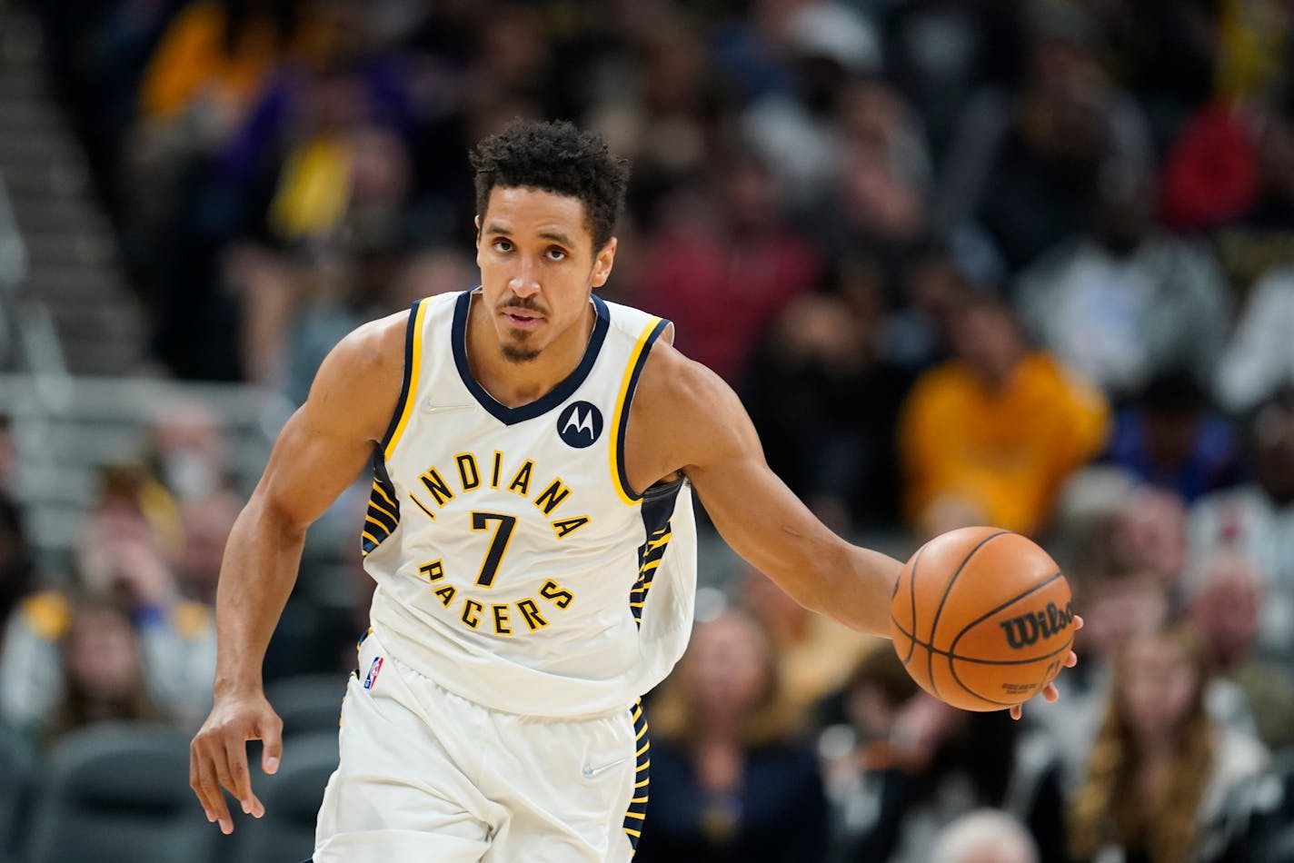 Indiana Pacers' Malcolm Brogdon (7) dribbles during the second half of an NBA basketball game against the Los Angeles Lakers, Wednesday, Nov. 24, 2021, in Indianapolis. (AP Photo/Darron Cummings)