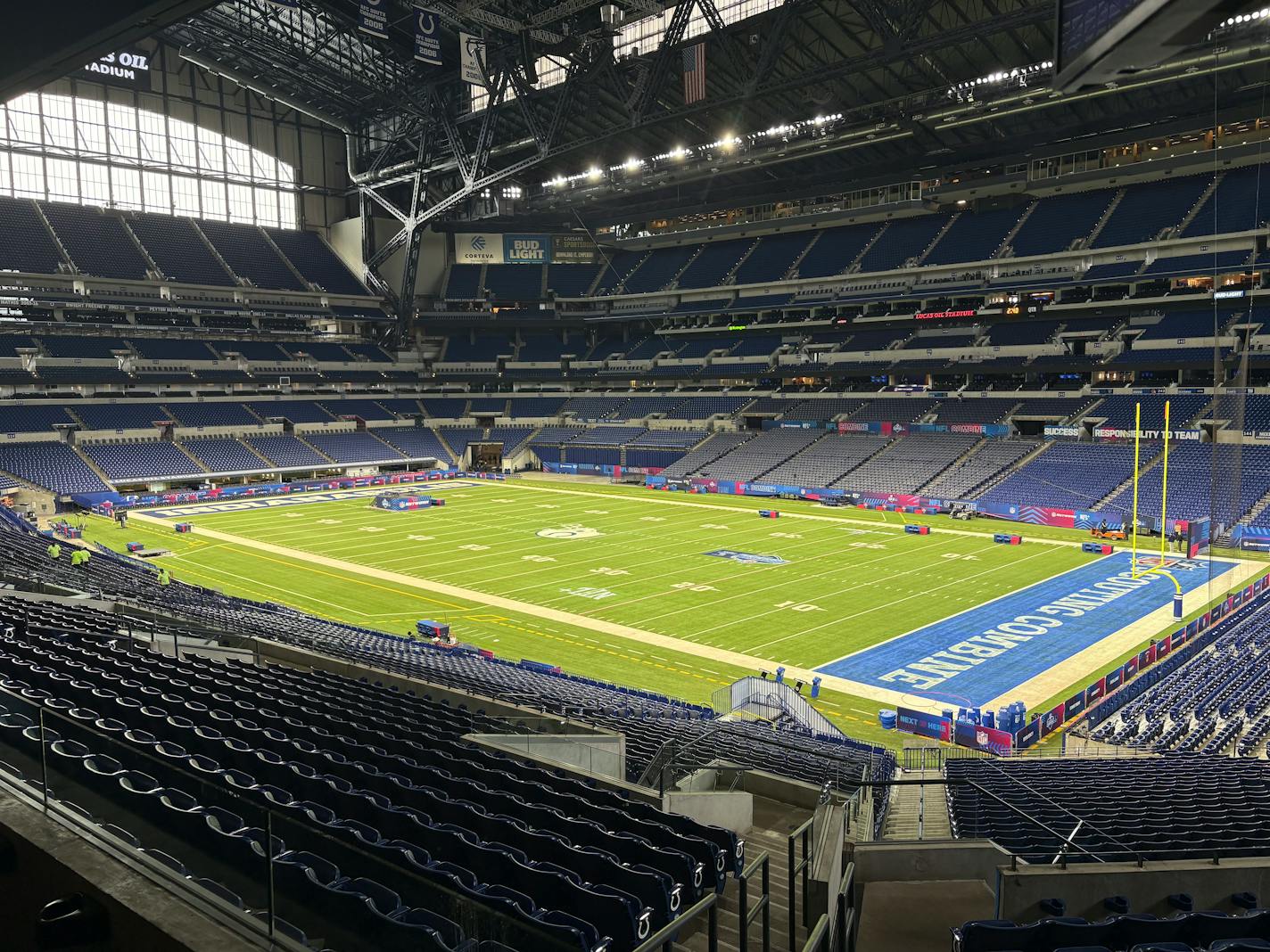 A view of the field inside Lucas Oil Stadium from suite level looking down over one corner of an end zone.