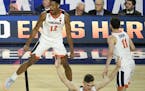 Virginia guard De'Andre Hunter (12) celebrated after making a three point shot during the second half. ] AARON LAVINSKY &#x2022; Aaron.lavinsky@startr