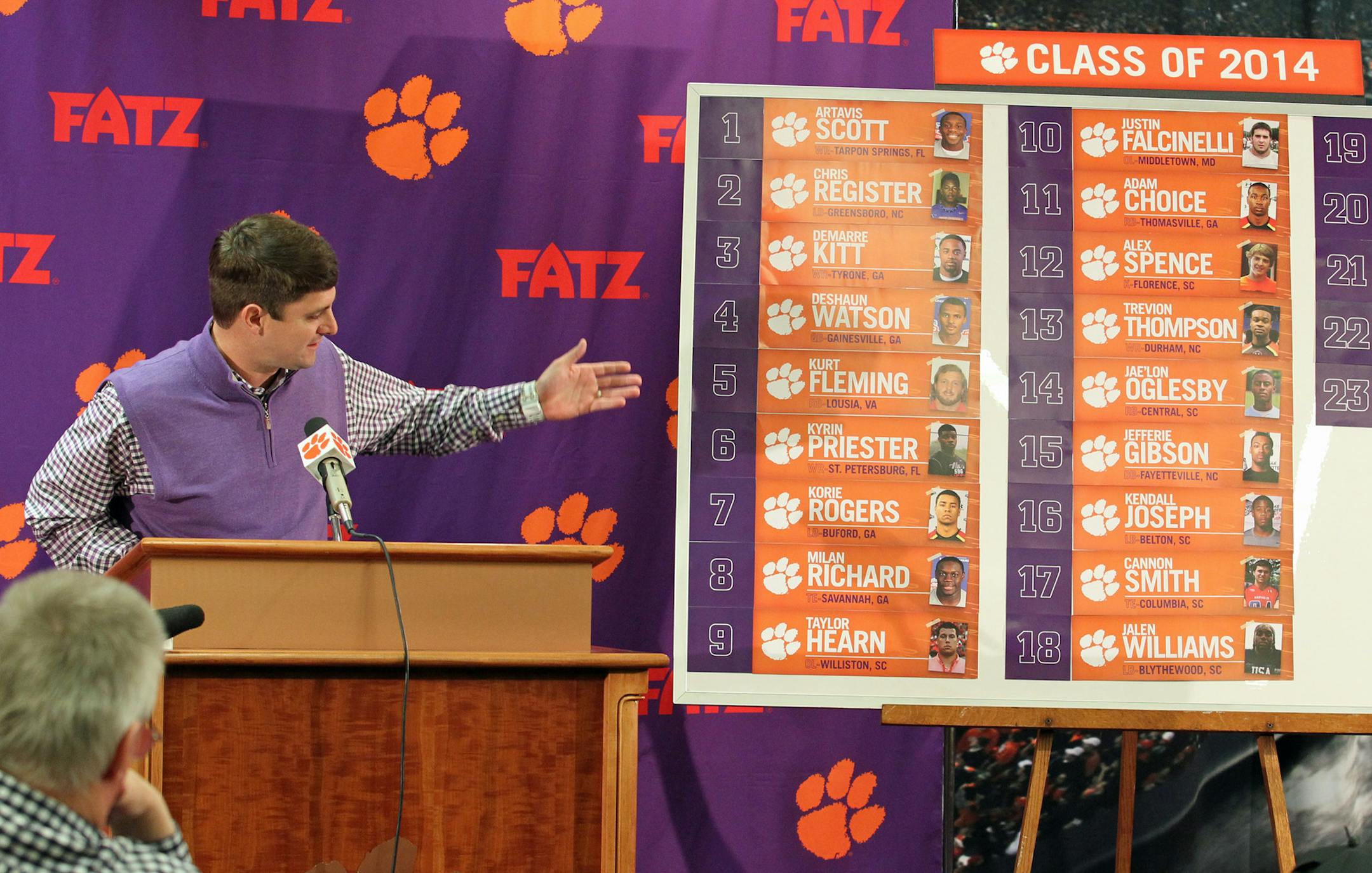 Clemson football recruiting coordinator Jeff Scott points to a board listing the team's recruiting class on national signing day, during a news conference in Clemson, S.C., on Wednesday, Feb. 5, 2014. (AP Photo/Anderson Independent-Mail, Mark Crammer) GREENVILLE OUT SENECA OUT ORG XMIT: MIN2014021817471010