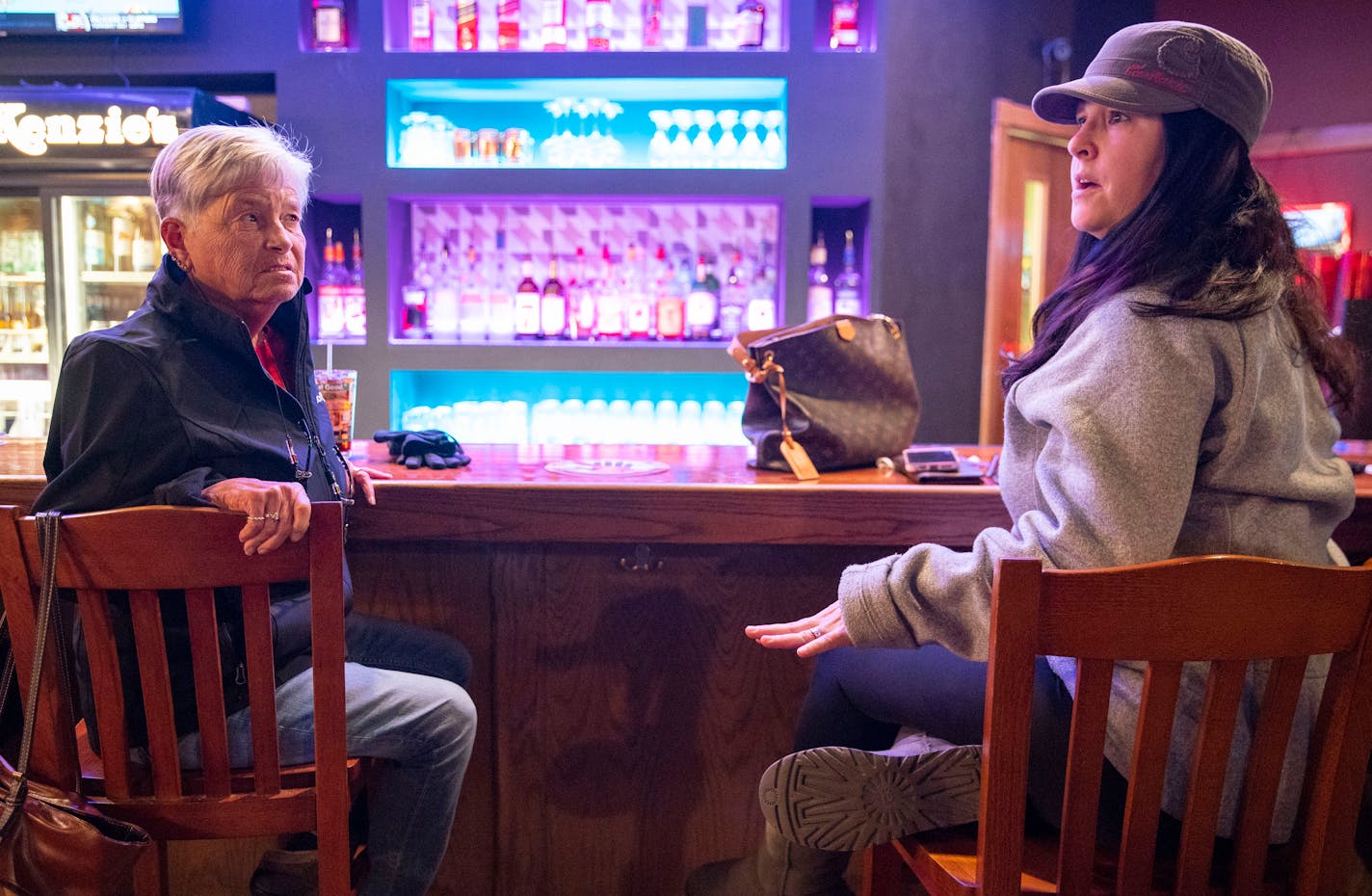 Pam Carlson, left, and Amy McClure calmly discussed and debated the second impeachment of President Trump inside McKenzie's Bar &amp; Grill in Hermantown, Minn. on Wednesday. Carlson supports impeachment while McClure does not.