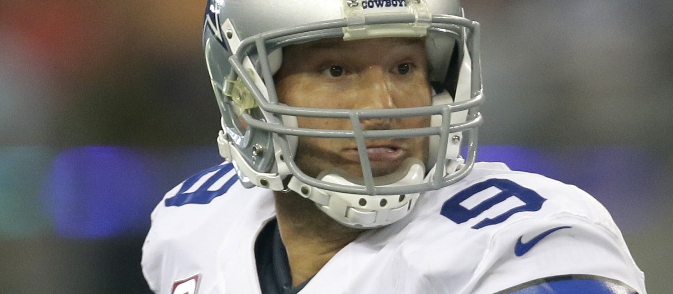Dallas Cowboys quarterback Tony Romo (9) scrambles out of the pocket looking to pass against the Denver Broncos during the fourth quarter of an NFL football game, Sunday, Oct. 6, 2013, in Arlington, Texas. The Broncos won 51- 48. (AP Photo/Tony Gutierrez)