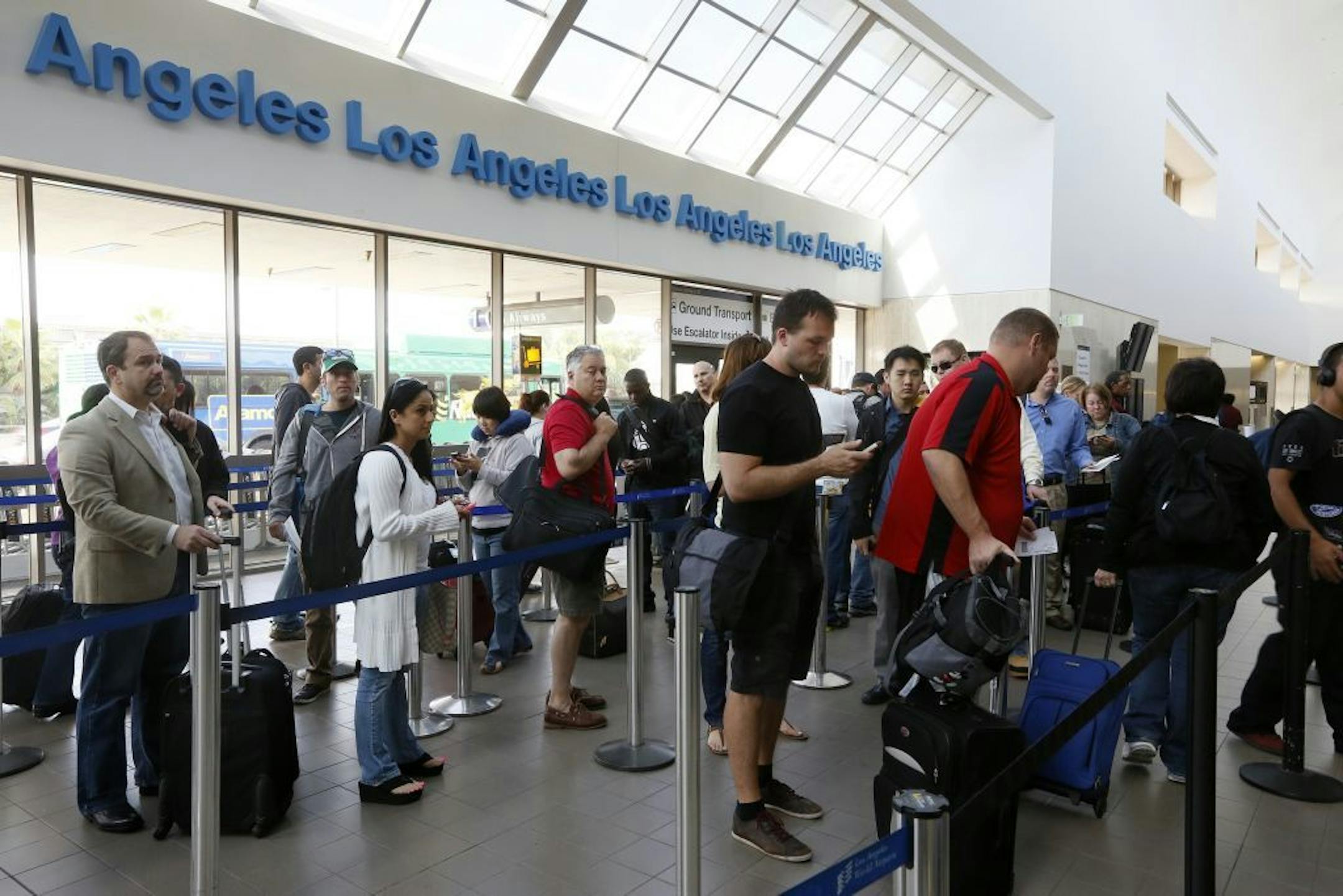 Travelers at the LAX International Airport in Los Angeles.