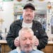 Dennis Manning cuts Robert Langle's hair Tuesday, Nov. 07, 2023, at Sportsmen's Barbers in Columbia Heights, Minn. The barbershop is being forced to v