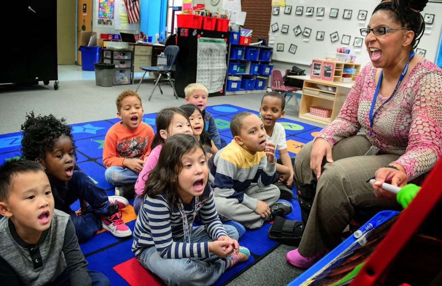 Kindergarten teacher Katina Edwards reads "Two Little Bears" to her students at St. Paul's Eastern Heights Elementary School. In the city, 76 percent of elementary school students are children of color.