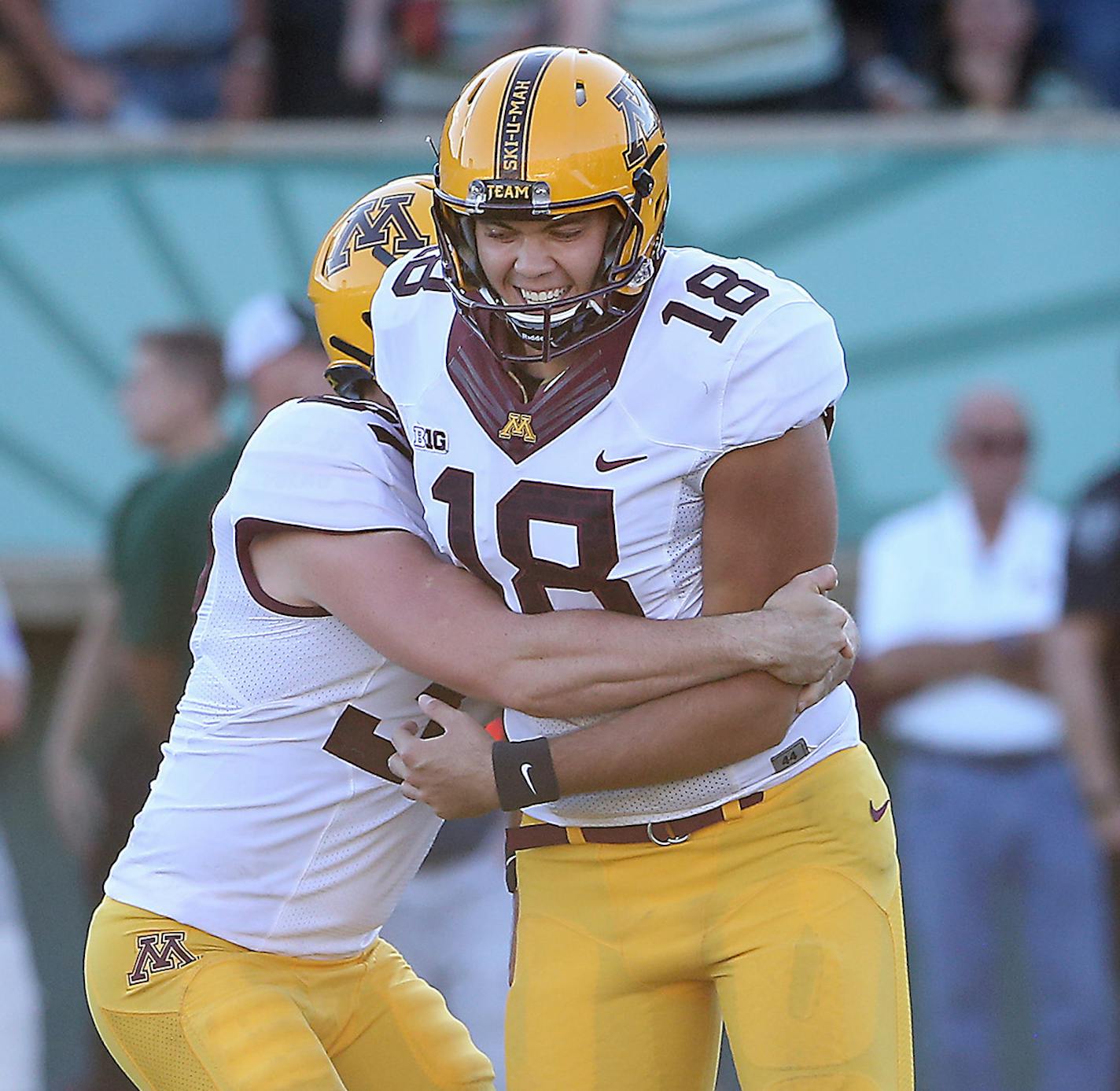 Ryan Santoso (18) was hugged by Peter Mortell after he kicked the winning chip-shot field goal in overtime