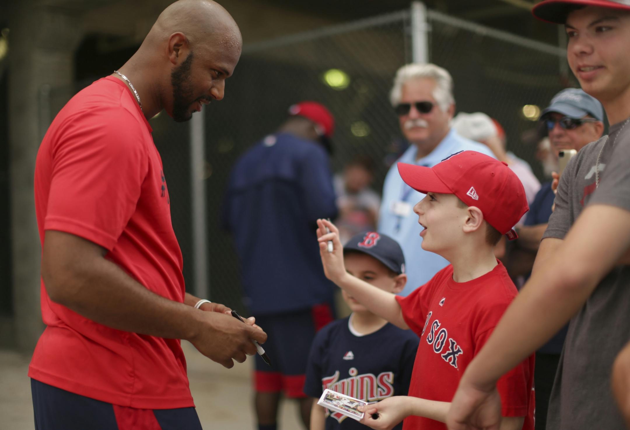 Zach Muroff, 10, of Boston, visited with outfielder Aaron Hicks while Hicks signed and autograph for him as he came off the field after working out Monday morning at Hammond Stadium.