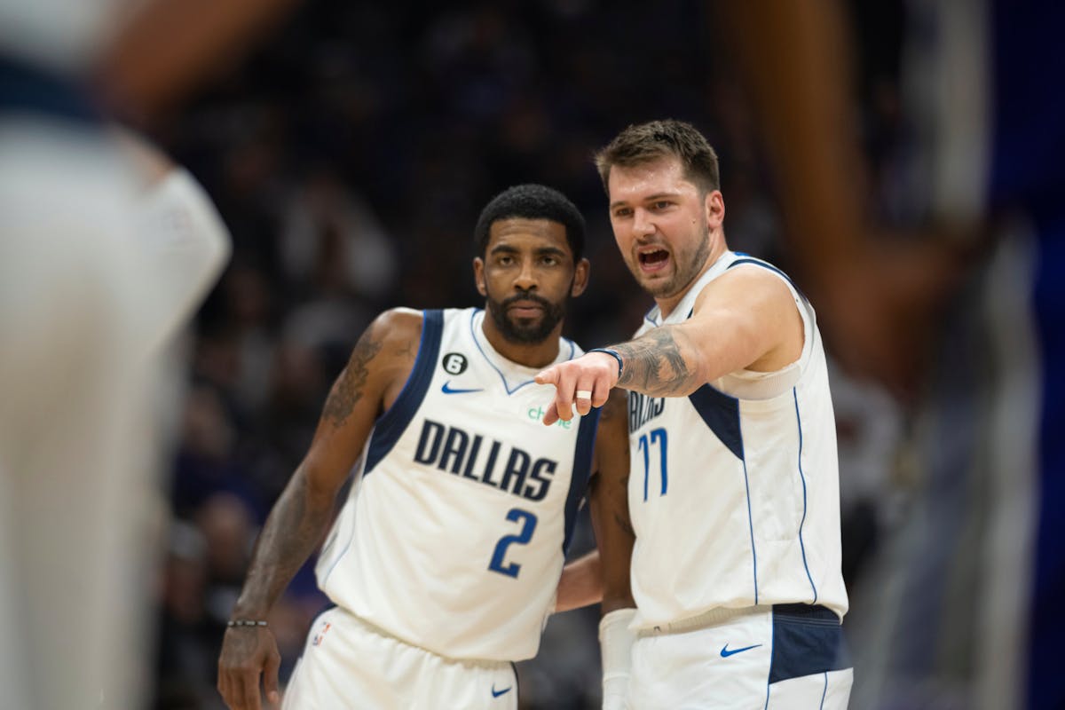 Dallas Mavericks guard Kyrie Irving (2) listens to guard Luka Doncic (77) in the first quarter of an NBA basketball game against the Sacramento Kings 