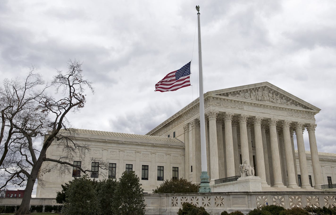 In honor of Justice Antonin Scalia who died on Feb. 13, 2016, the flags in the Supreme Court building's front plaza will continue to fly at half-staff for a month, in Washington, Thursday, Feb. 25, 2016. Scalia&#xed;s unexpected death triggered an election-year political standoff on Capitol Hill as leaders in the GOP-controlled Congress insist President Obama should not nominate a replacement for Scalia and should leave that for the next president who is elected in November. (AP Photo/J. Scott A