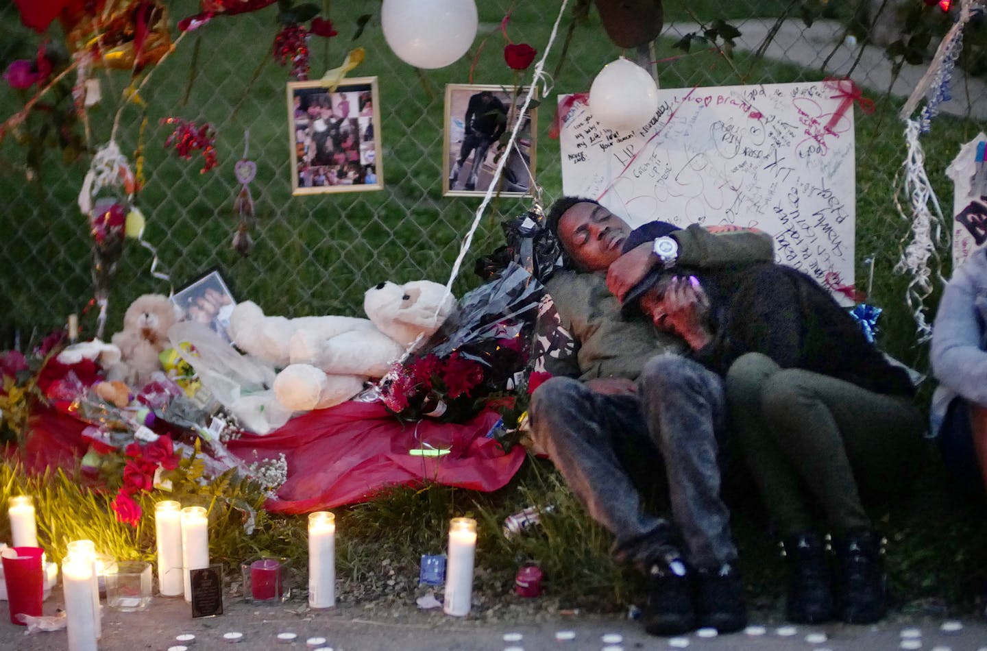 Mourners gathered earlier this month at an impromptu memorial of balloons and flowers off Olson Highway near where 25-year-old Derrick Rodgers was slain. Officials worry that a recent spike in gun violence in Minneapolis will only worsen as the weather warms up.