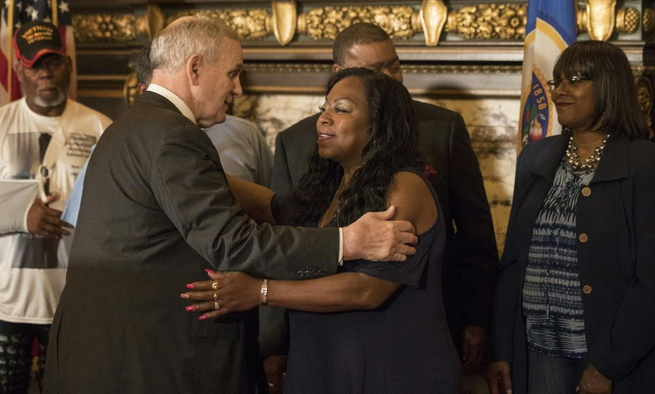 Gov. Mark Dayton embraced Valerie Castile after proposing that a $12 million training fund for law enforcement be named after her son, Philando Castile.