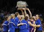 Win-E-Mac players celebrated their Class 1A championship upset victory over No. 1-seeded Minneota on Saturday at Willams Arena.