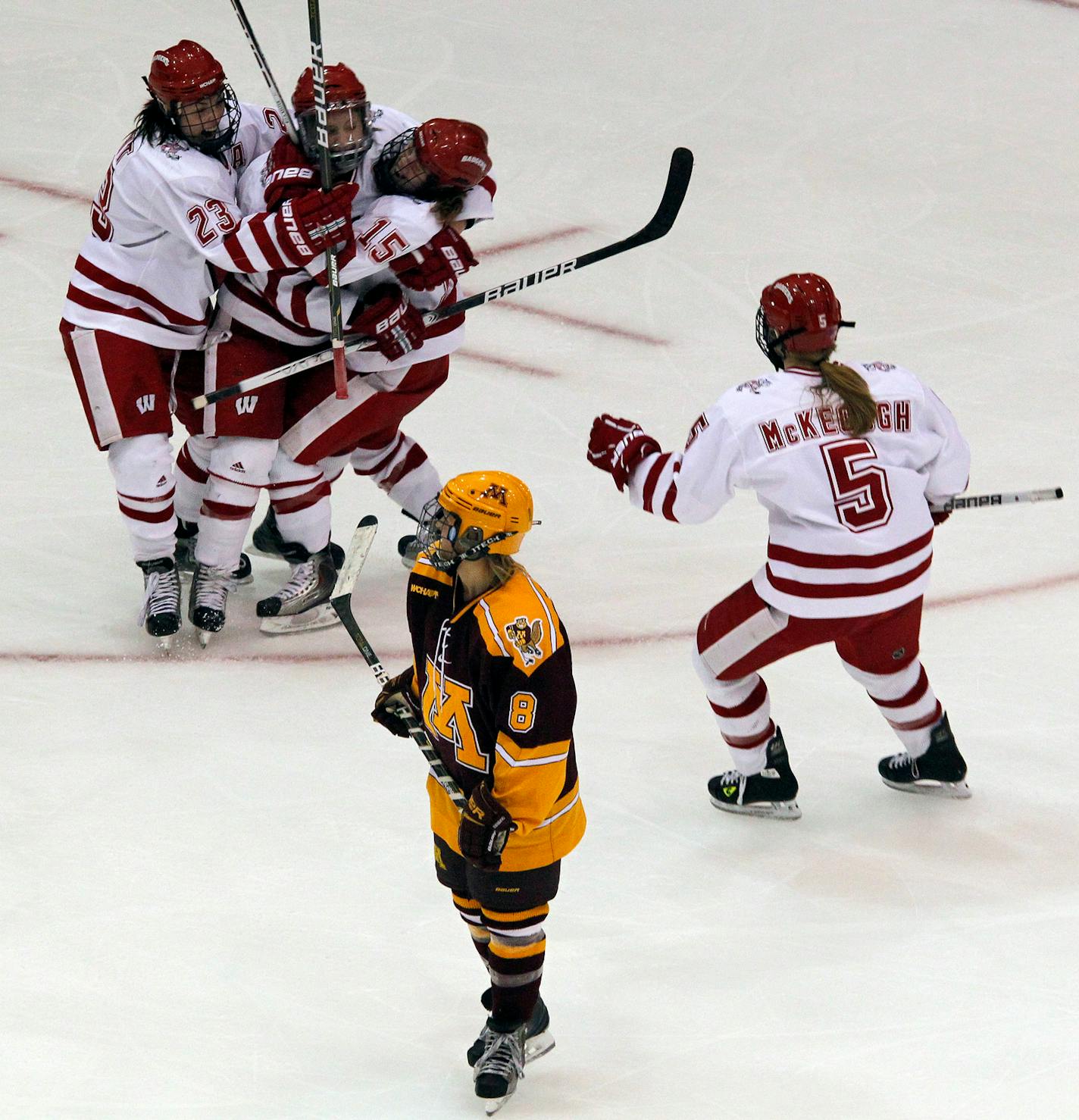 MARLIN LEVISON*mlevison@startribune.com GENERAL INFORMATION. Gophers womens hockey WCHA tournament vs. Wisconsin. Wisconsin won in overtime 5-4. IN THIS PHOTO: ] Minnesota's Amanda Kessel (8) looked on as Wisconsin players celebrated their tieing score in regulation play.