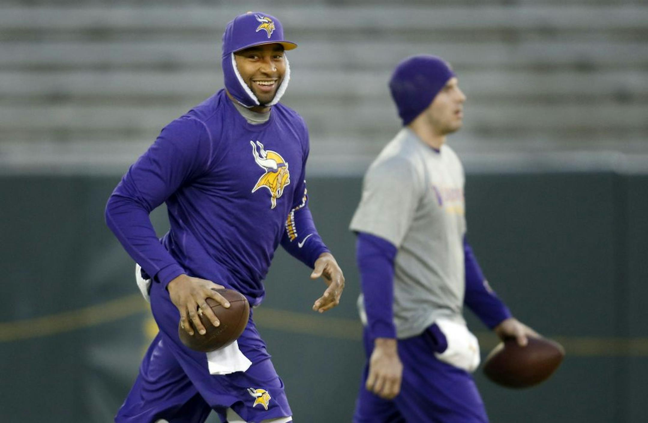 Minnesota Vikings quarterbacks Joe Webb and Christian Ponder walked out on the field for early pregame warm ups at Lambeau Field.