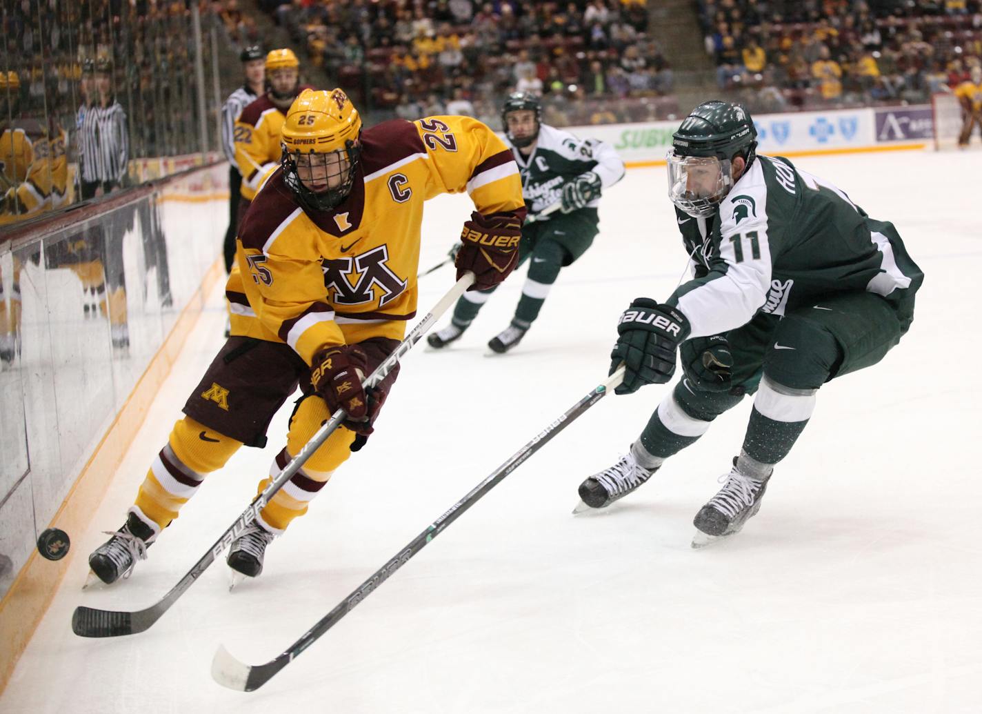 Justin Kloos (left) and the Gophers received the No. 1 seed in the Northeast Regional and will play Notre Dame in the first round of the NCAA hockey tournament.