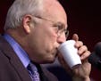 Republican vice presidential candidate Dick Cheney takes a drink while the crowd applauds during his speech in Gallatin, Tenn., on Thursday, Nov. 2, 2