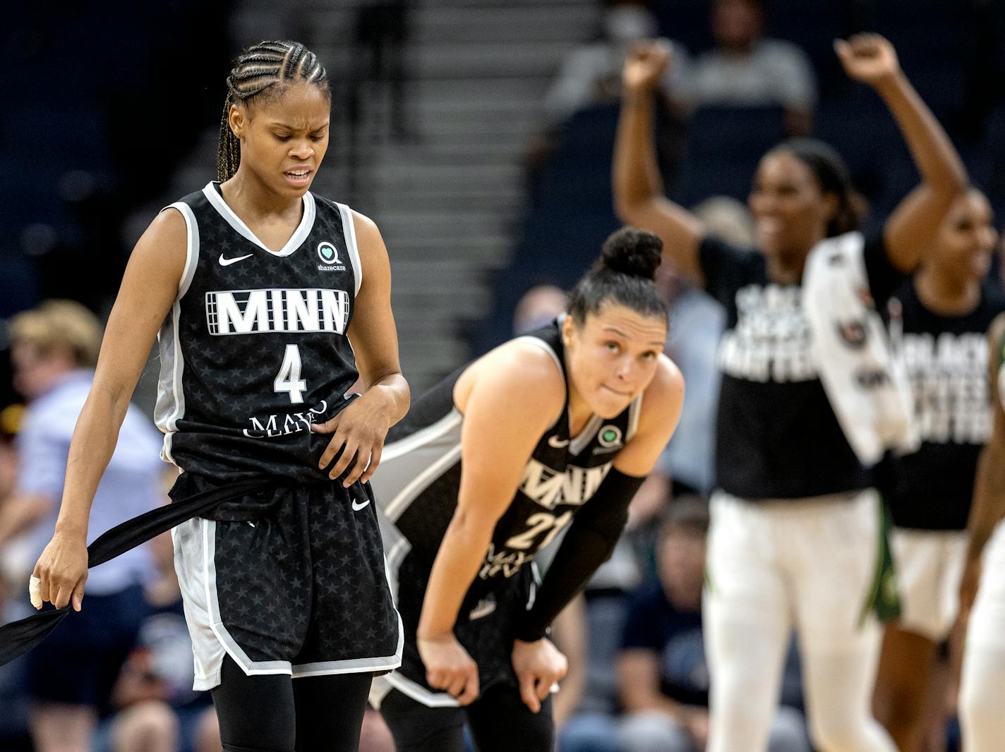 Moriah Jefferson (4) and Kayla McBride (21) of the Minnesota Lynx at the end of the game Tuesday, June 14, 2022 at Target Center in Minneapolis, Minn. ] CARLOS GONZALEZ • carlos.gonzalez@startribune.com