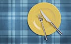 "Empty yellow plate and fork,and table knife on plaid tablecloth. Table setting Include clipping paths.For similar images"