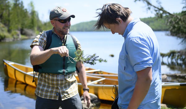 Tony Jones baptized his 14-year old son, Aidan, as a neophyte voyageur at the completion of the Height of Land Portage in the BWCA. ] Aaron Lavinsky �