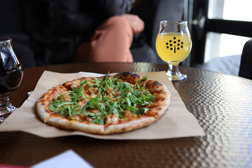 Ciders flavored with other fruits are rare at Number 12 Cider in Minneapolis; high-alcohol ciders aged in previously used barrels are a specialty. Little Tomato has wood-fired pizzas on site, too.