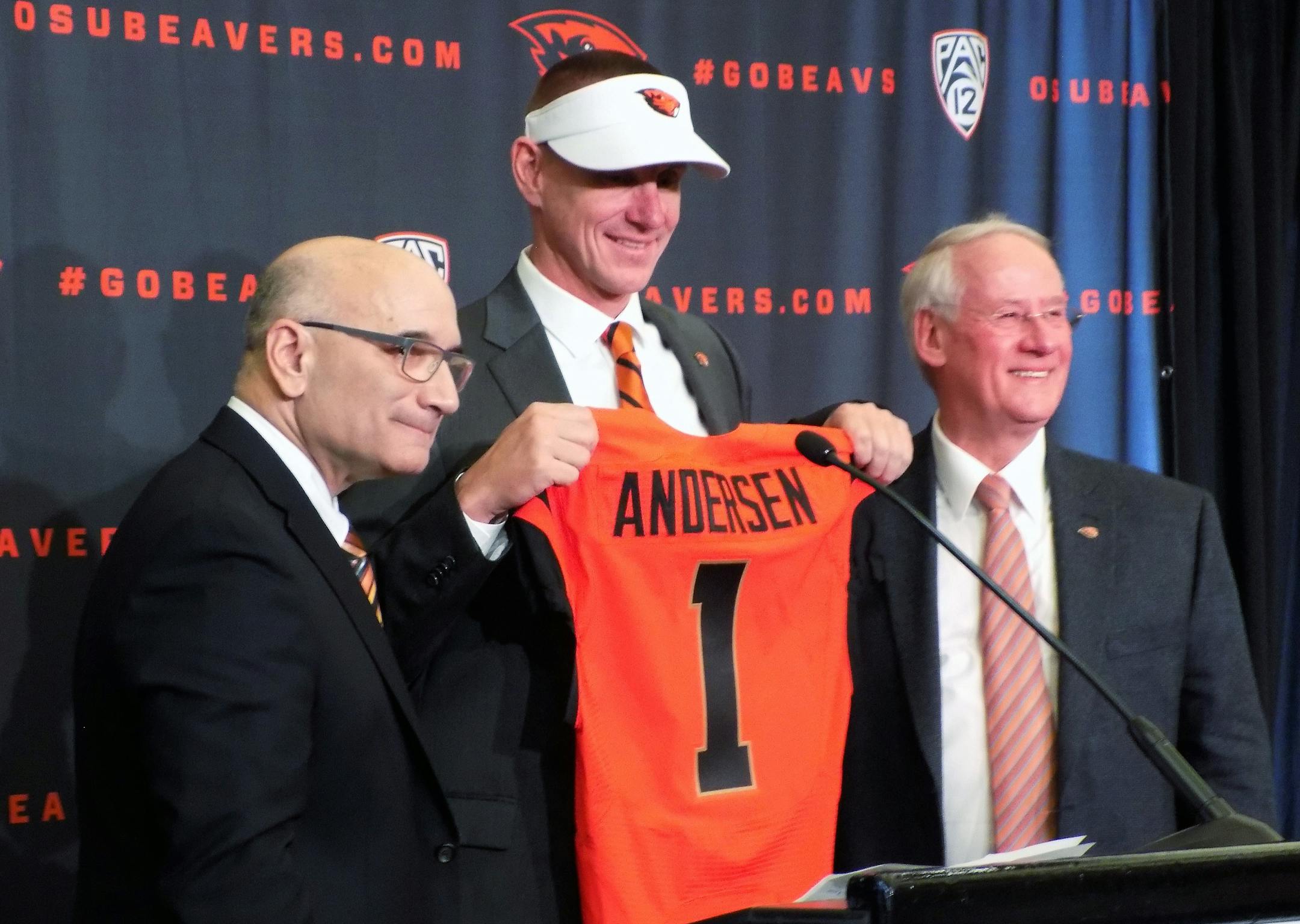 Oregon State new football coach, Gary Andersen, center, poses with Oregon State athletic director, Bob De Carolis, left, and Oregon State University president, Edward Ray, at a news conference in Corvallis, Oregon, on Dec. 12, 2014. Andersen comes to the Beavers after two seasons as head coach at Wisconsin. (AP Photo/Anne Peteson)