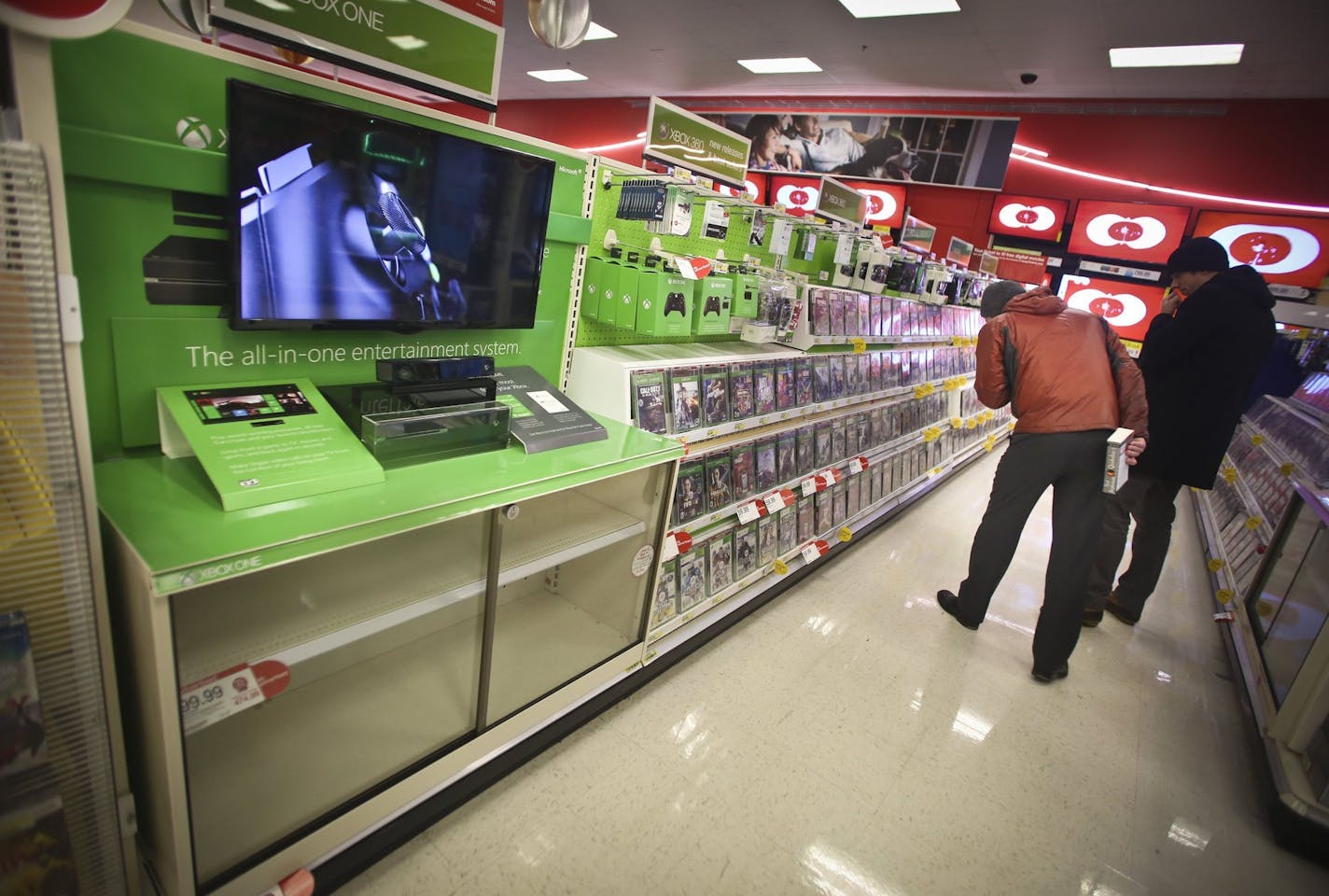 Customers look at Xbox games despite the fact that all the Xbox Ones were sold out at Target in downtown Minneapolis, Dec. 4, 2013. With the introduction of PlayStation 4 and Xbox One, the first new video game consoles in 7 years, Best Buy and other retailers are hoping for a big lift to their holiday sales. (Renee Jones Schneider/Minneapolis Star Tribune/MCT) ORG XMIT: 1146562