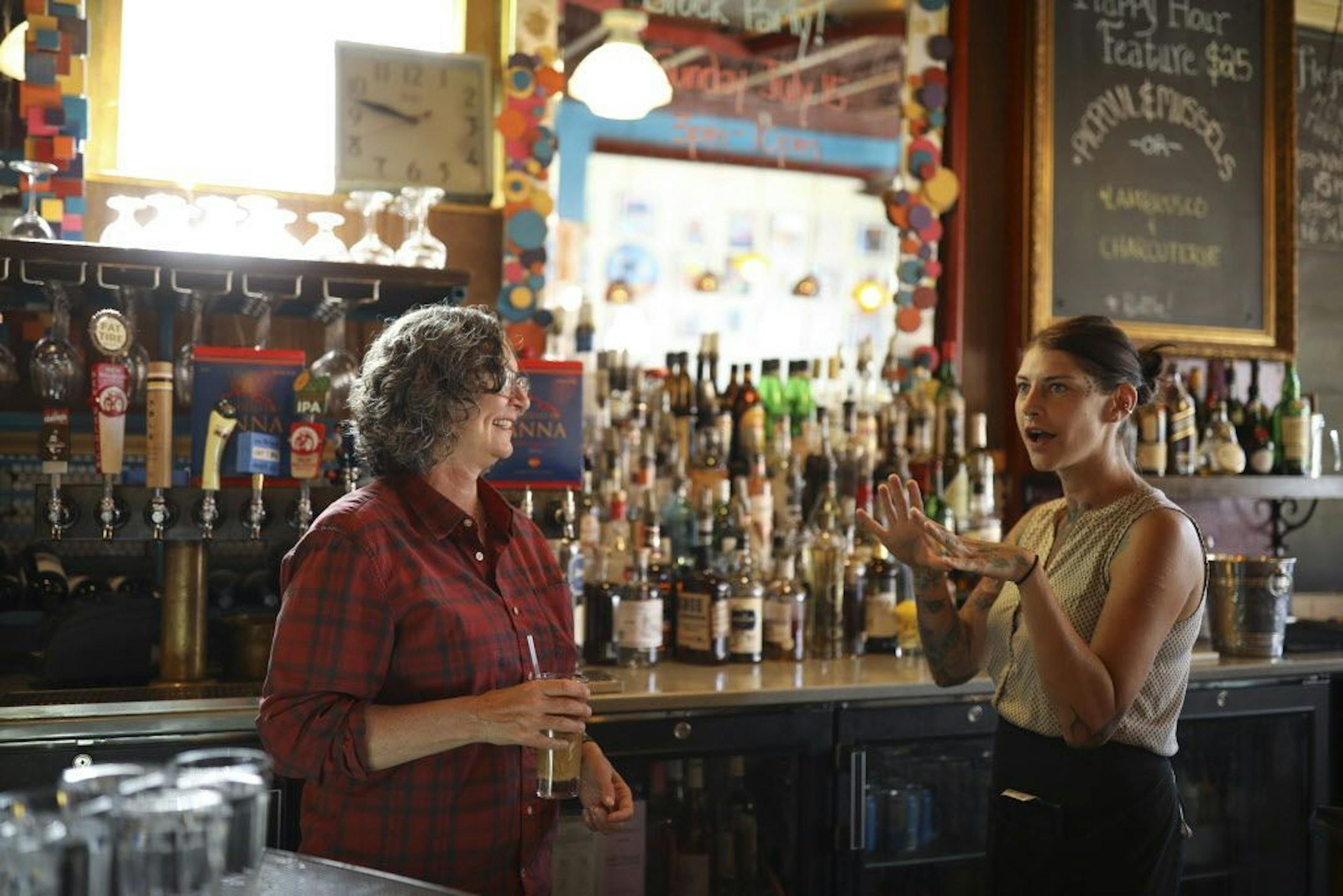 Kim Bartmann visited with server Meghan Decker while fixing herself an iced coffee before a morning meeting at Barbette.