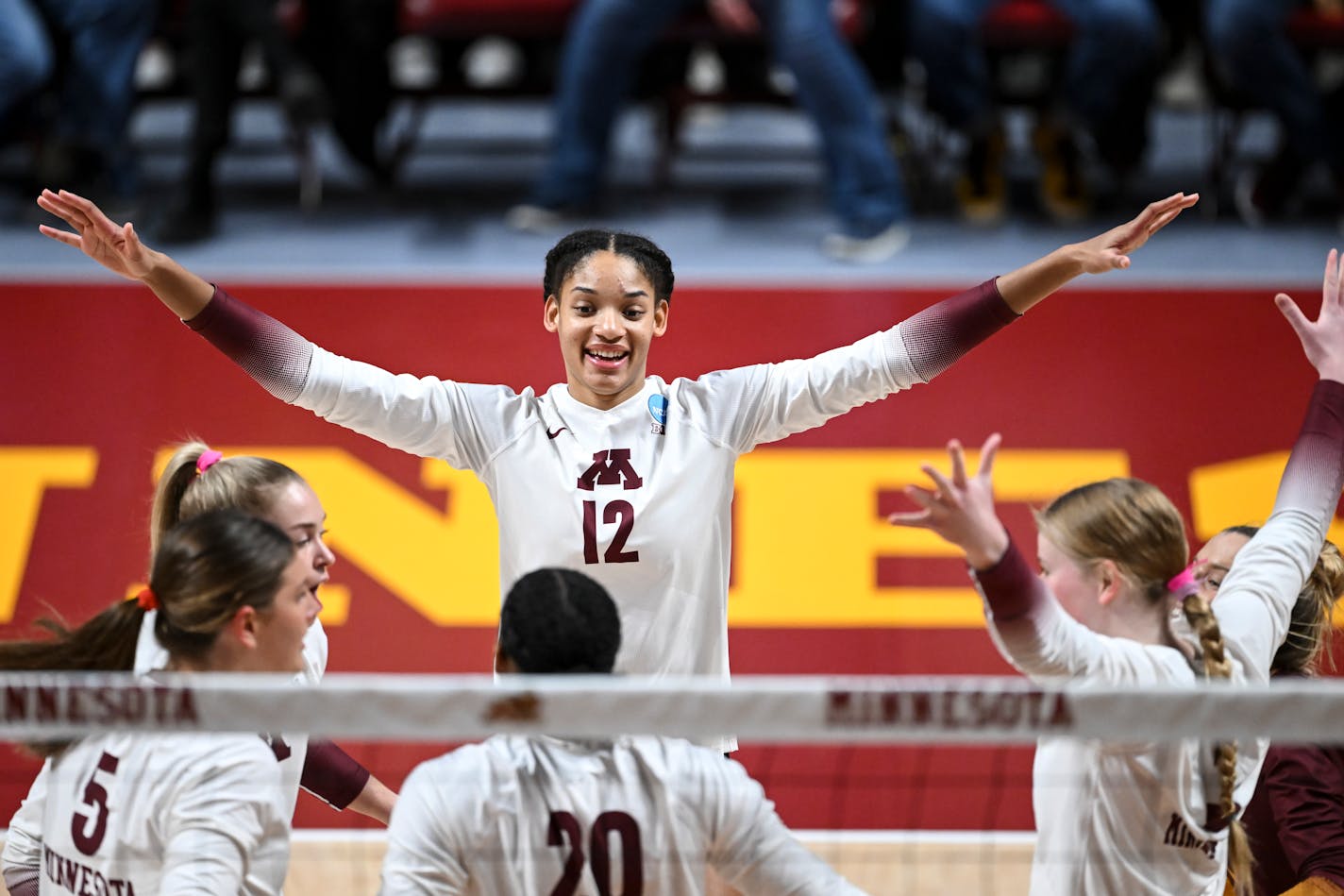 Minnesota Gophers players, including Minnesota Gophers outside hitter Taylor Landfair (12), celebrate a point scored against Southeastern Louisiana during the first set Friday, Dec. 2, 2022 at the University of Minnesota Athletic Pavilion in Minneapolis, Minn... ] AARON LAVINSKY • aaron.lavinsky@startribune.com