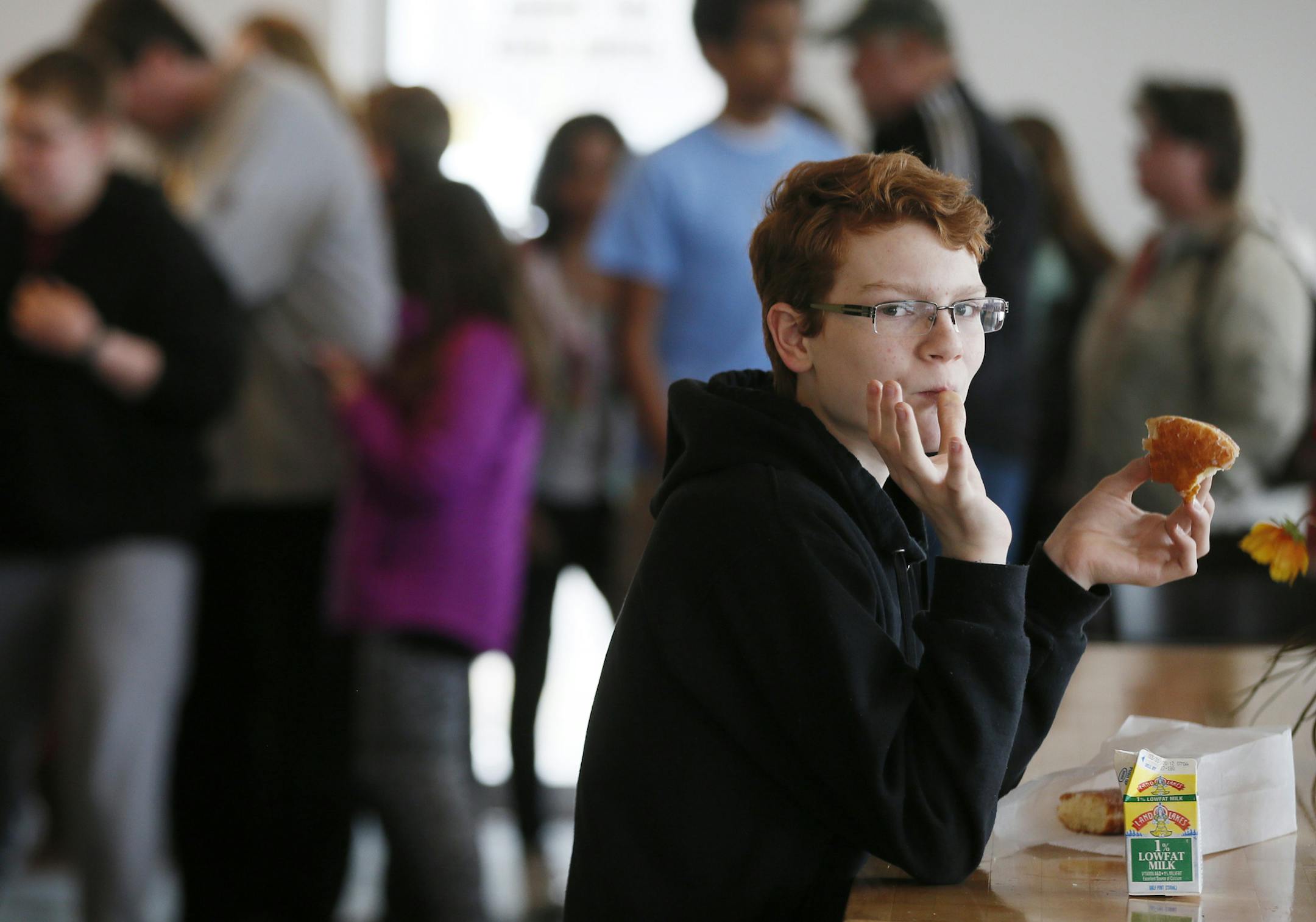 Devin Irwin 13, enjoyed his donut Tuesday March 25, 2014 at Hans Bakery in Anoka, Minnesota ]JERRY HOLT jerry.holt@startribune.com