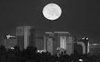 The first supermoon of the new year rises above the Vegas Strip on Monday, Jan. 1, 2018. A supermoon occurs when the moon is full at the same time it 