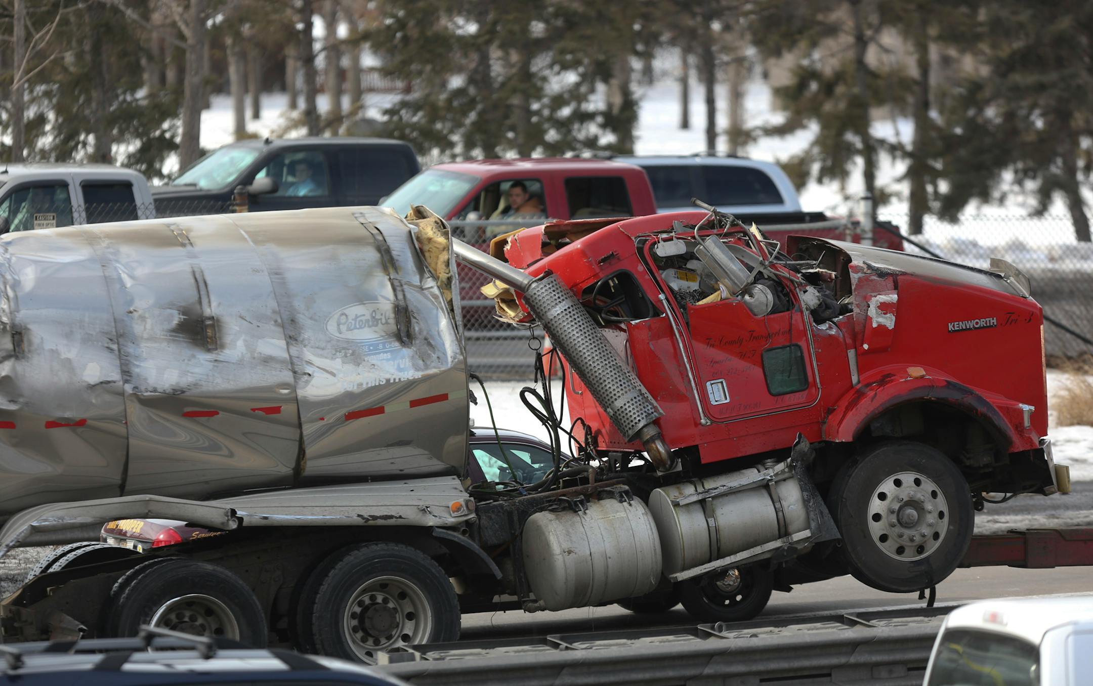 The milk truck involved in an accident Wednesday was towed to the side of the road as the rest of the milk was drained near the Lowry Tunnel in Minneapolis on February 27, 2013.