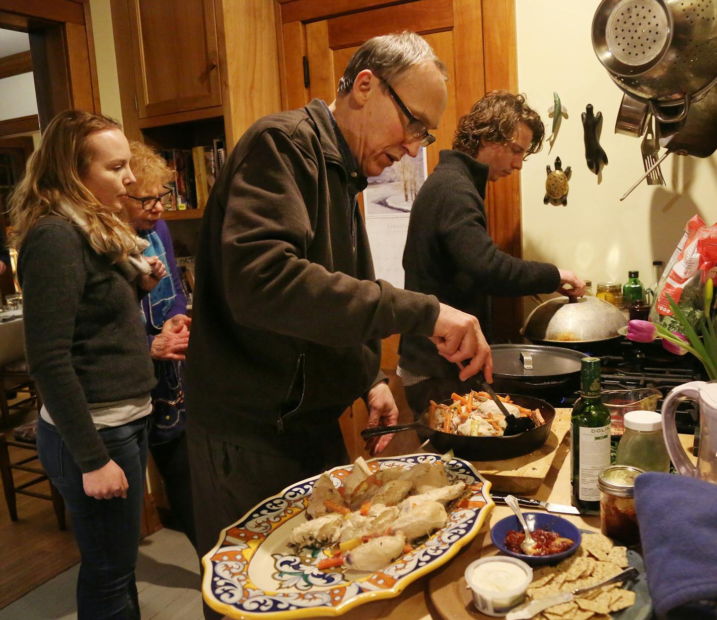 Two families, their children and occasionally friends have been dining together weekly for about 30 years. Here, Don Luce, center, and son Logan Luce, right, work on dinner.] DAVID JOLES &#xef; david.joles@startribune.com Two families have been dining weekly for 30 years, brought together by young children and continuing on through moments of celebration and sadness. While they now are gearing back on frequency, they have something to say about community, tradition -- and food.