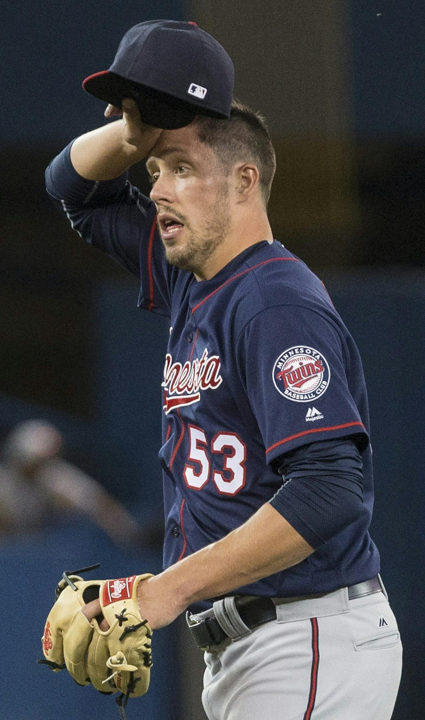 Minnesota Twins relief pitcher Pat Light reacts during sixth-inning baseball game action against the Toronto Blue Jays in Toronto, Friday, Aug. 26, 2016. (Chris Young/The Canadian Press via AP) ORG XMIT: MIN2016083023384057