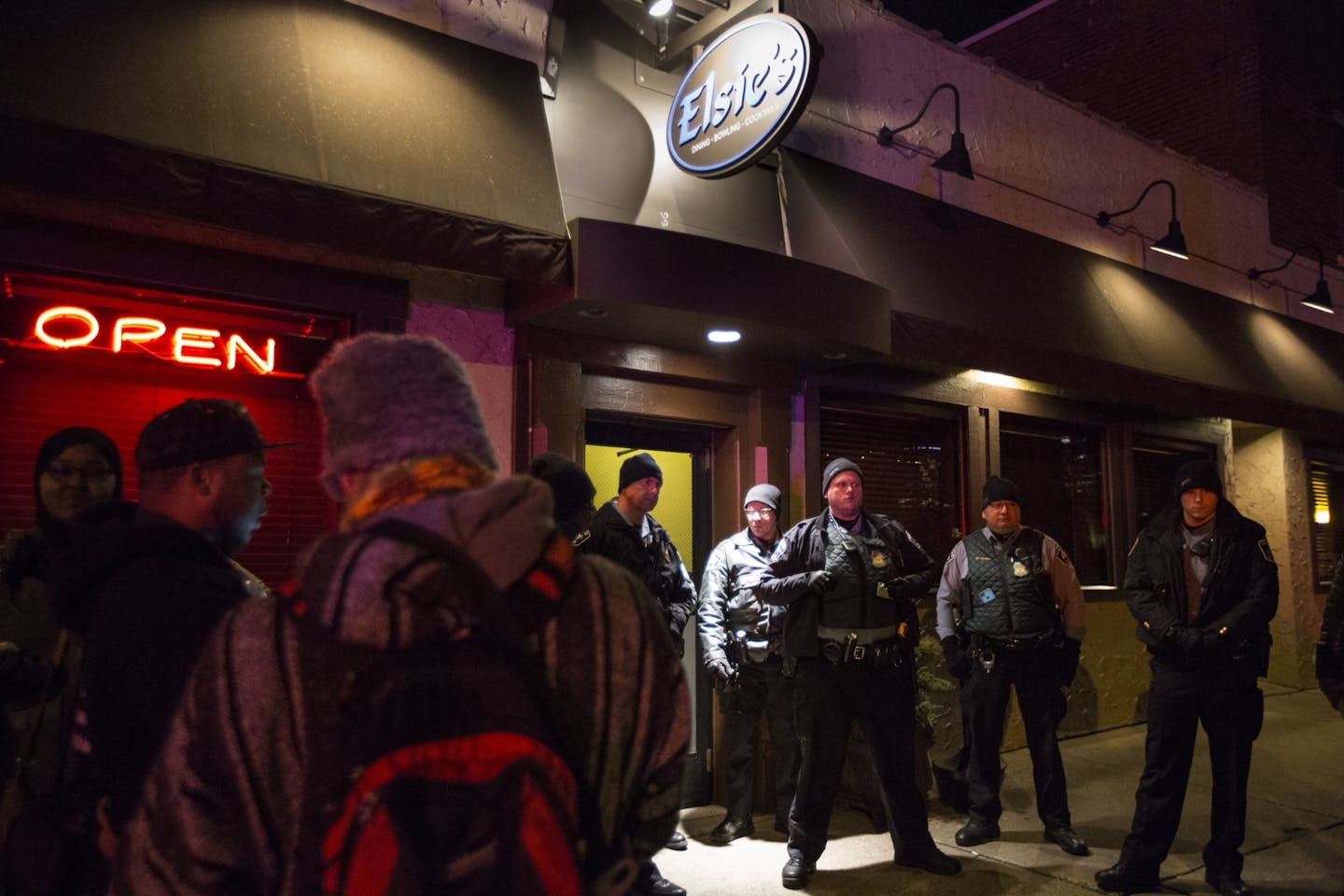 Police guarded a door from protesters at Elsie's where the Minneapolis Police Union had held and earlier fundraiser on Thursday, December 3, 2015, in Minneapolis, Minn.