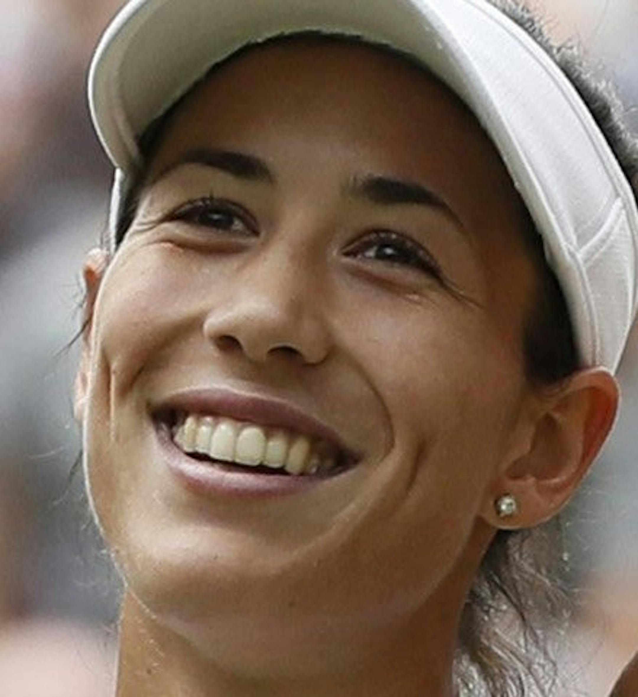 Spain's Garbine Muguruza celebrates after beating Slovakia's Magdalena Rybarikova in their Women's Singles semifinal match on day nine at the Wimbledon Tennis Championships in London Thursday, July 13, 2017. (AP Photo/Kirsty Wigglesworth)