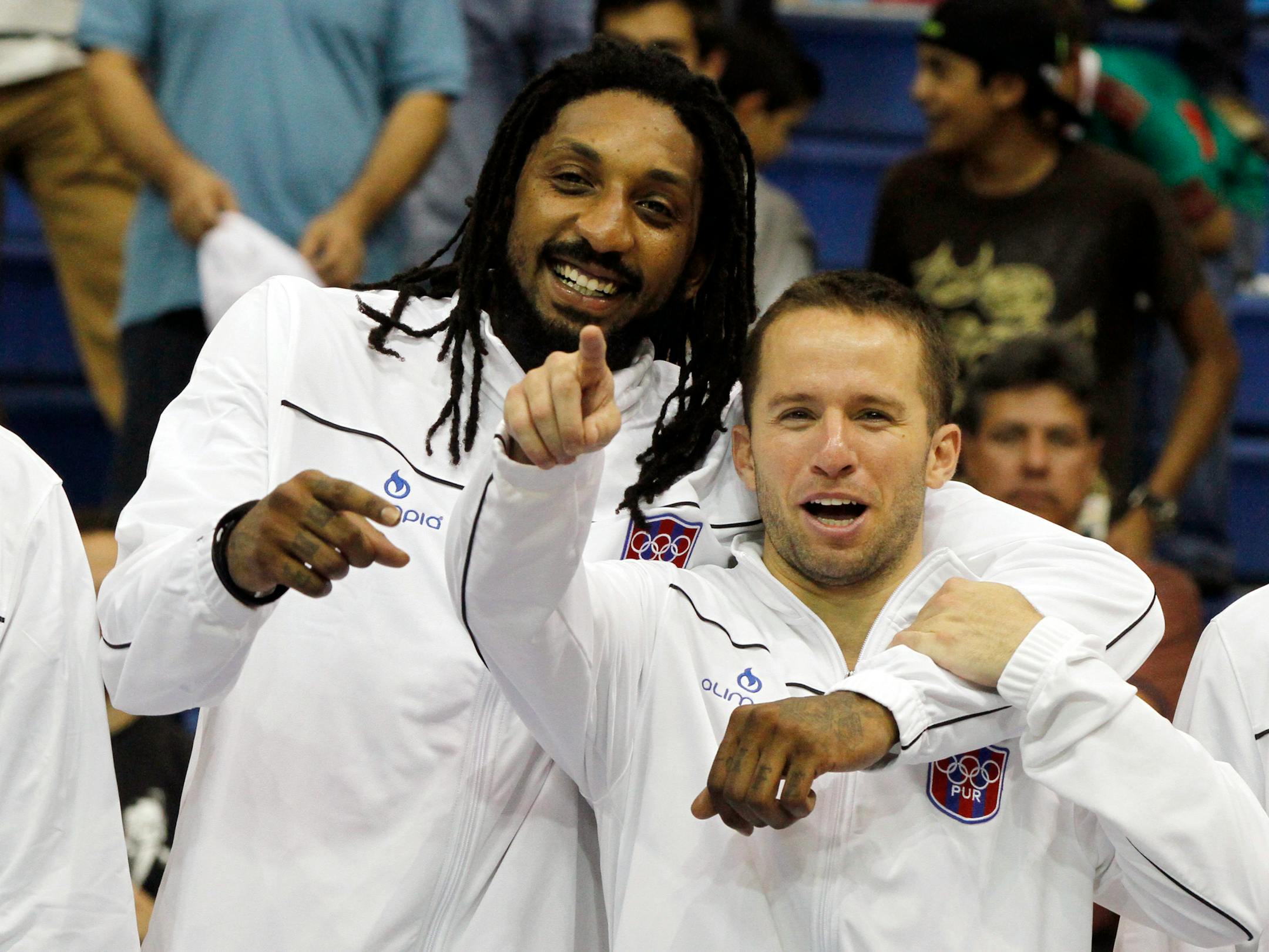 Puerto Rico's Jose Barea, right, jokes with teammate Renaldo Balkman during the award ceremony for the men's basketball at the Pan American Games in Guadalajara, Mexico, Sunday, Oct. 30, 2011. Puerto Rico won the gold medal after defeating Mexico 74-72.(AP Photo/Martin Mejia)