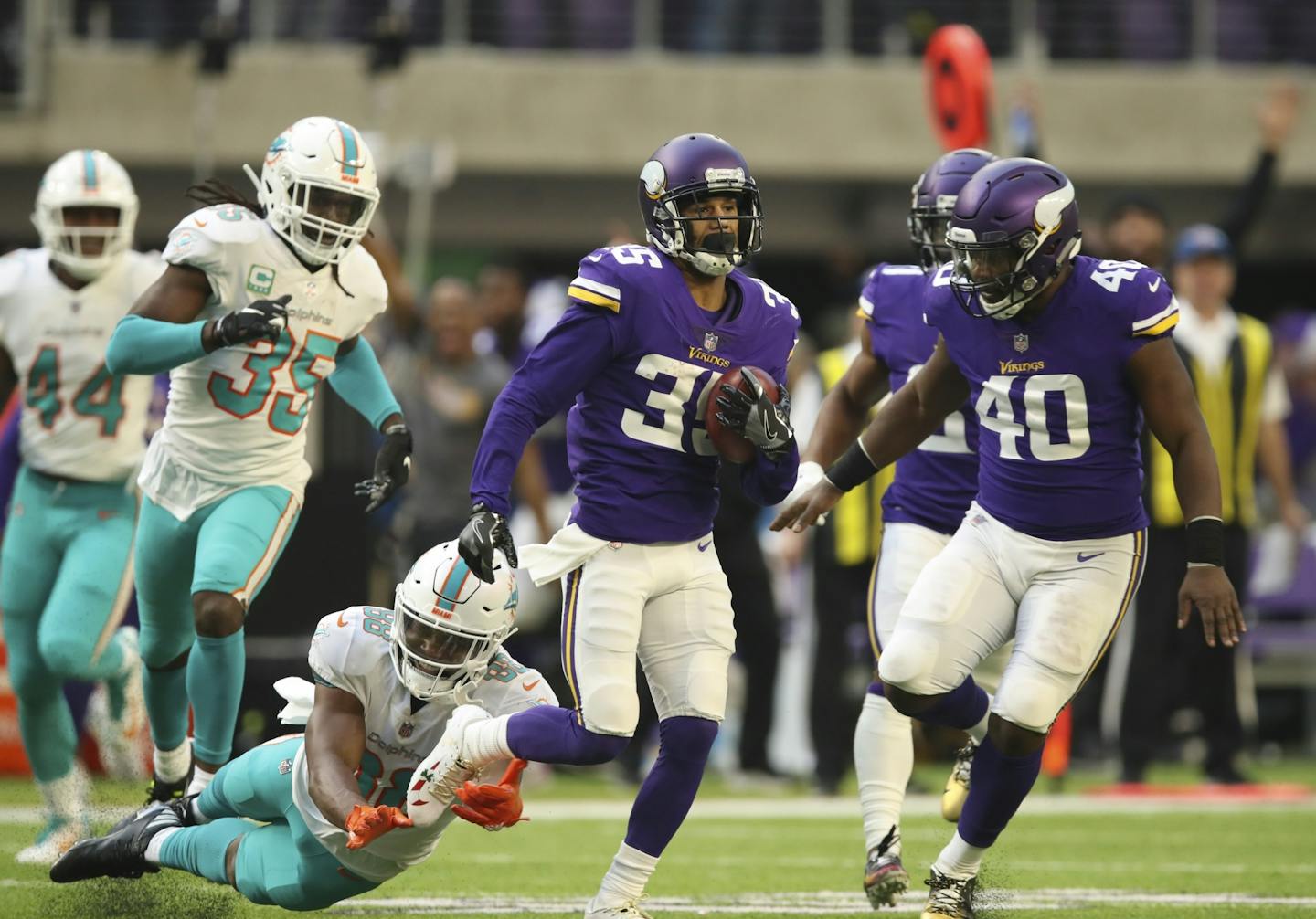 Minnesota Vikings defensive back Marcus Sherels (35) returned a third quarter punt for 70 yards before being tripped up by Miami Dolphins wide receiver Leonte Carroo (88).