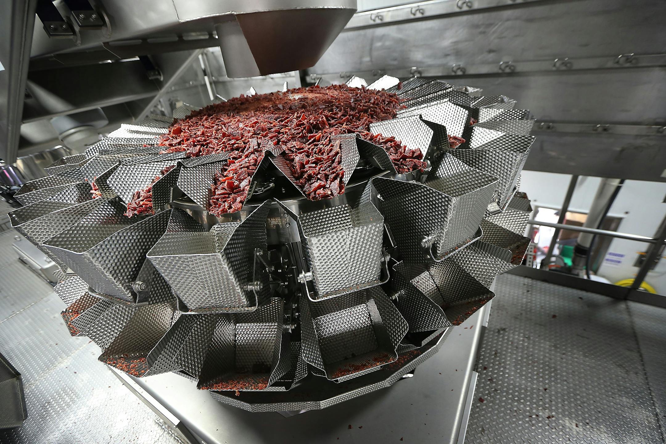 Jack Links beef jerky is moved via a scale machine, Monday, October 19, 2015 in Minong, Wis.