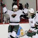 Jason Pominville, left, of the Minnesota Wild celebrates his goal with teammates Mikael Granlund (64) and Nino Niederreiter (22) while Jay Harrison of
